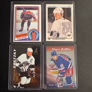 Wayne Gretzky hockey card lot featuring 4 cards from different teams